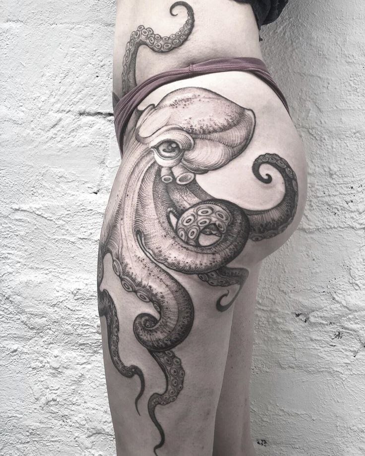 Large octopus tattoo on the thigh for women