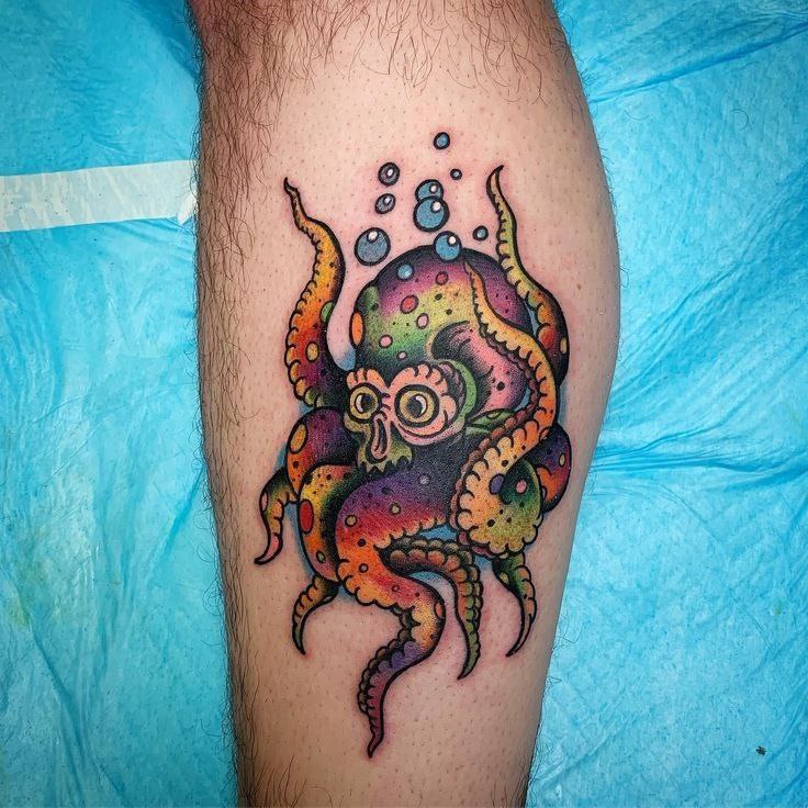 Colored octopus tattoo on the shin for men