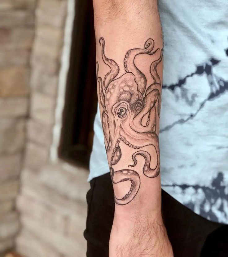 Tattoo of an octopus on the forearm for men