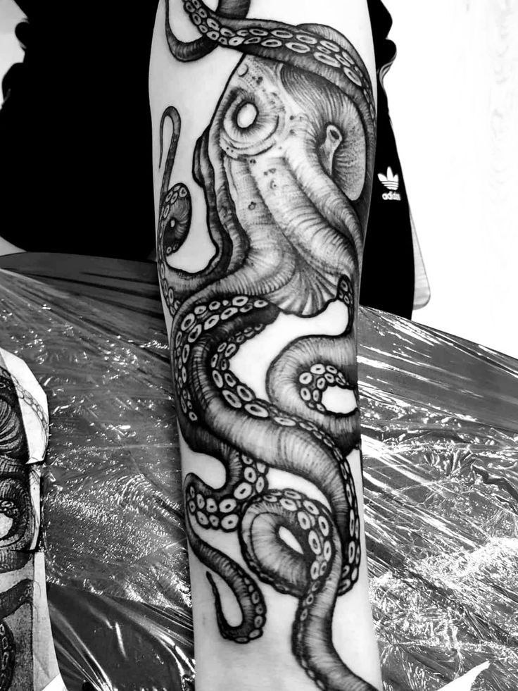 Large octopus tattoo on the forearm for men