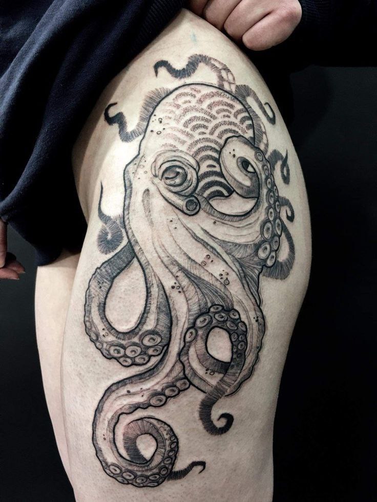 Large octopus tattoo on the thigh for women