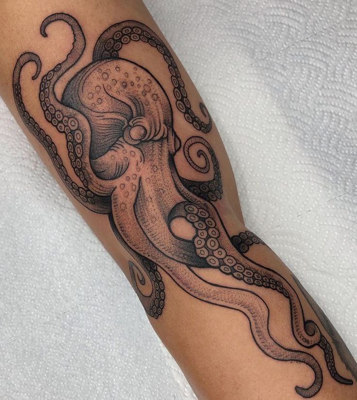 Large octopus tattoo on the arm for men