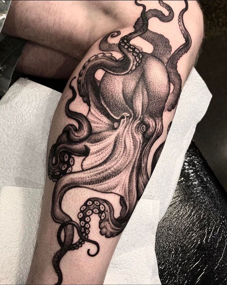 Large octopus tattoo on the shin for men