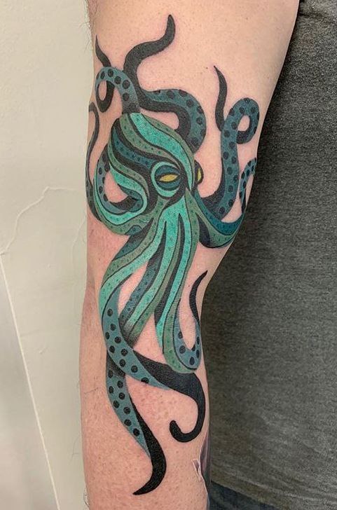 Colored octopus tattoo on the forearm for men