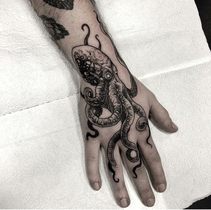 Large octopus tattoo on the hand for men