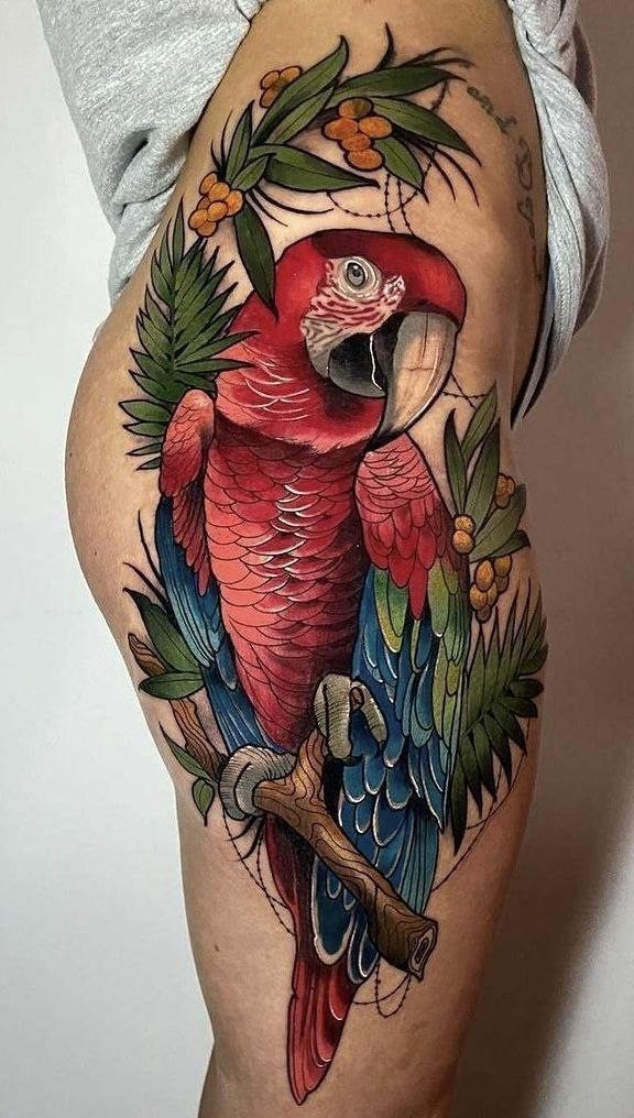 Large parrot tattoo on the thigh for women