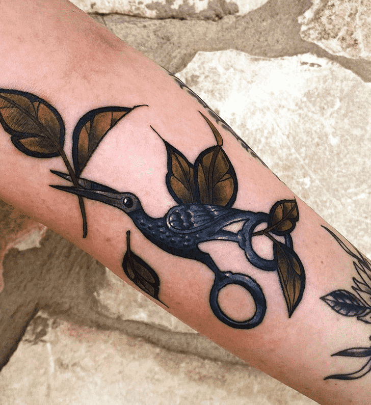 Colorful stork tattoo with leaves on the arm for women