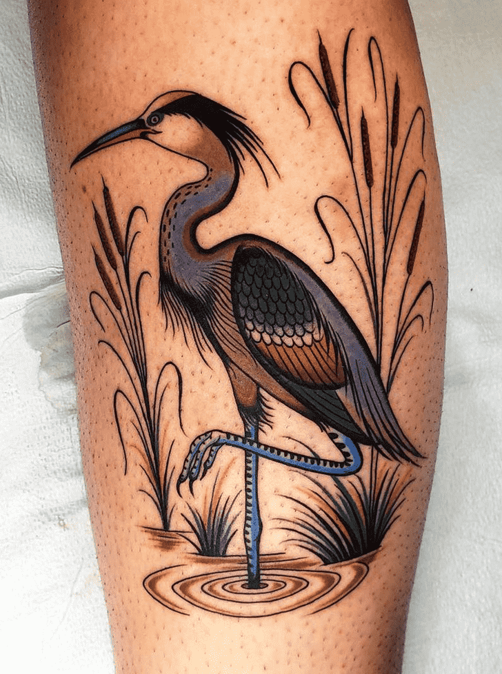 Colorful stork tattoo on the shin for women