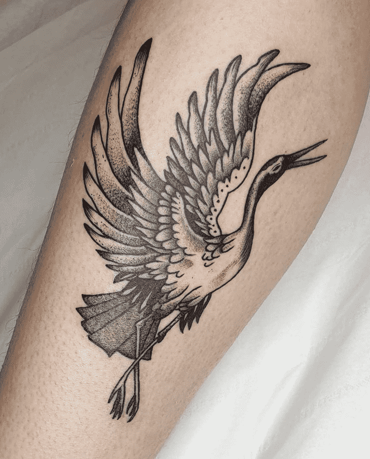 Stork tattoo on the shin for women