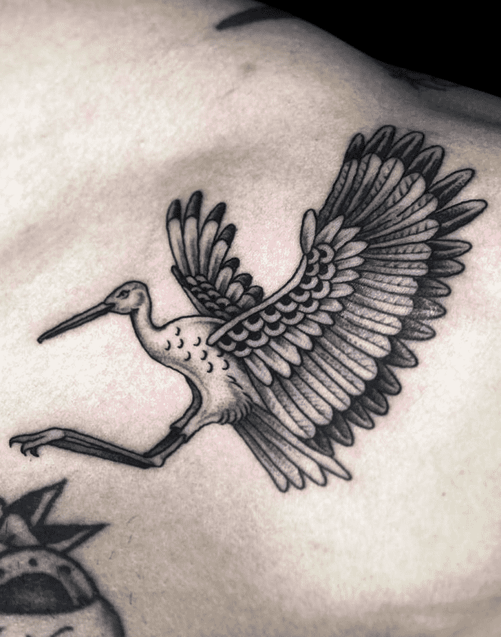 Large stork tattoo on the collarbone for men