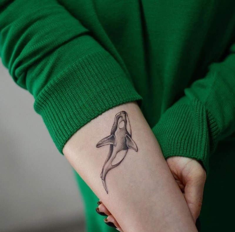 Orca tattoo on forearm for women