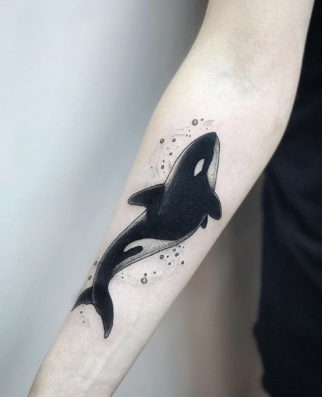 Large orca tattoo on the forearm for men