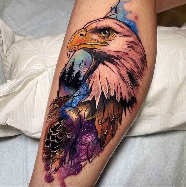 Color tattoo of an eagle on the shin for men