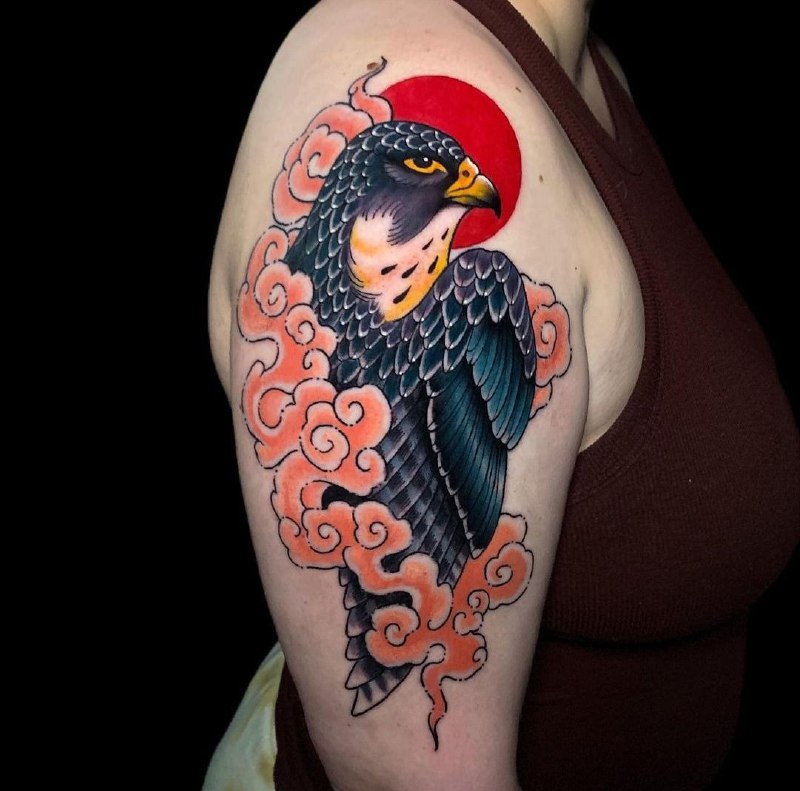 Color falcon tattoo on the shoulder for men