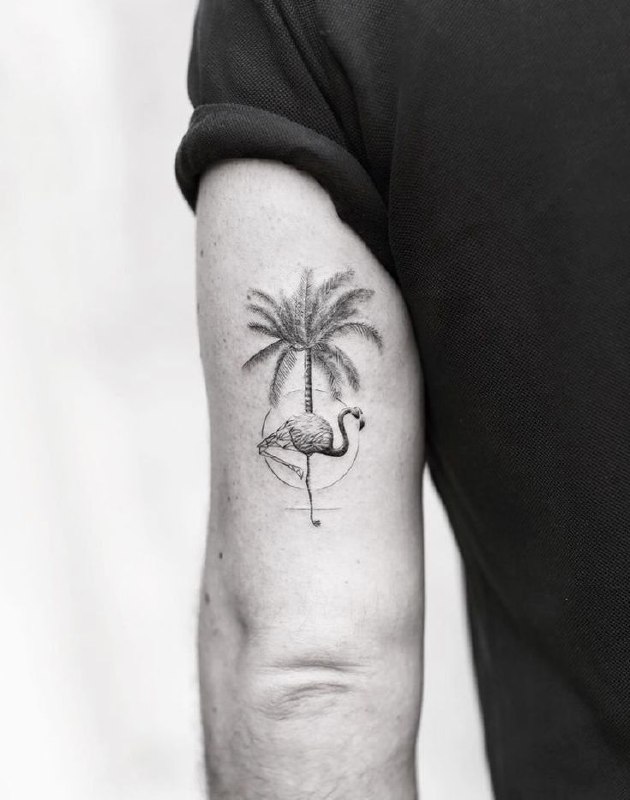 Flamingo tattoo with a palm tree on the shoulder for men