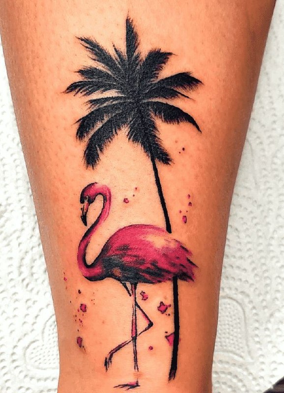 Color flamingo tattoo with a palm tree on the shin for women