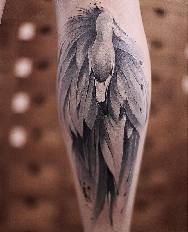 Large flamingo tattoo on the calf for women