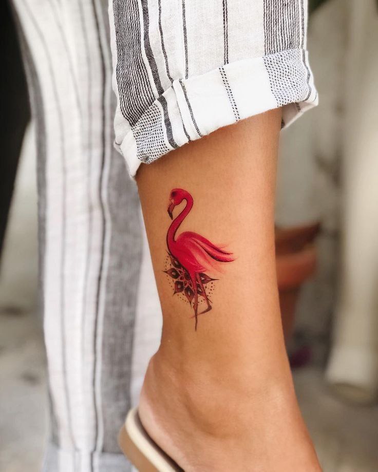 Color flamingo tattoo on the shin for women