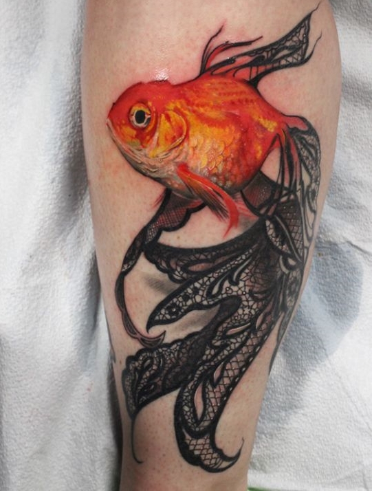 Large goldfish tattoo on the shin for women