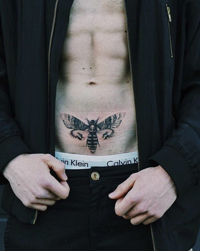 Large intimate moth tattoo for men