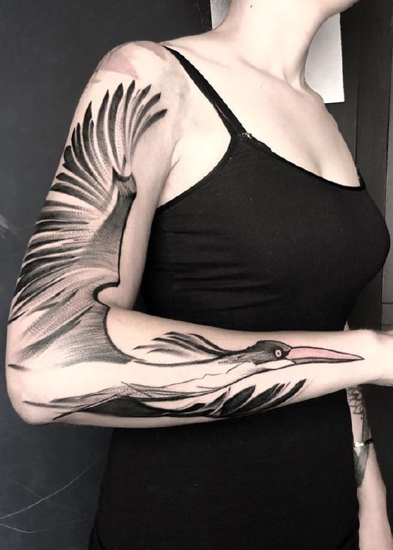 Large stork tattoo on the arm for women