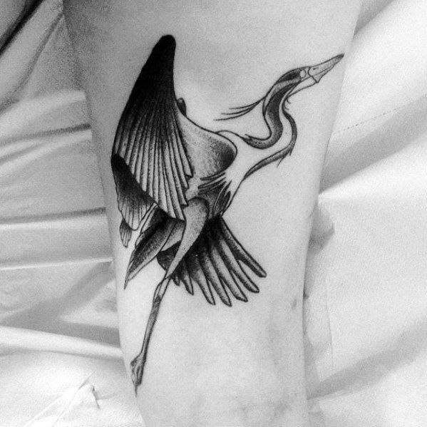 Stork tattoo on the shin for men