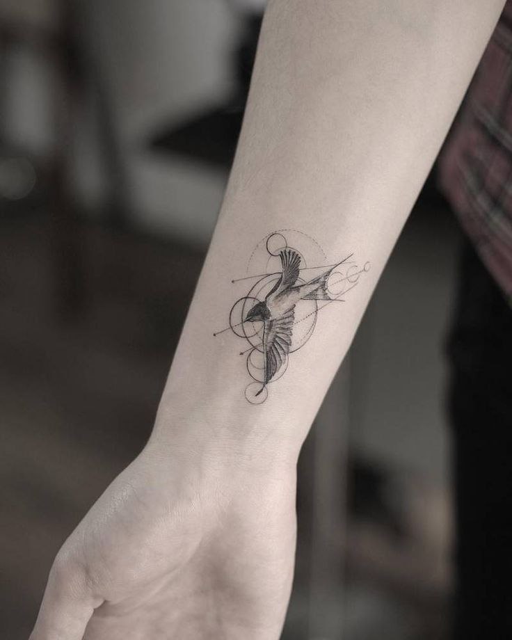 Swallow tattoo on forearm for women