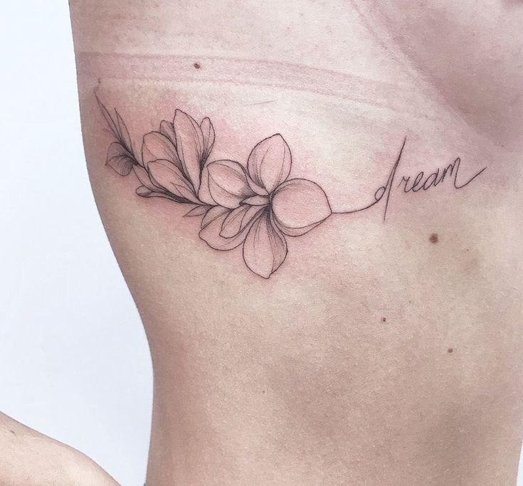 Flower tattoo on the side for women