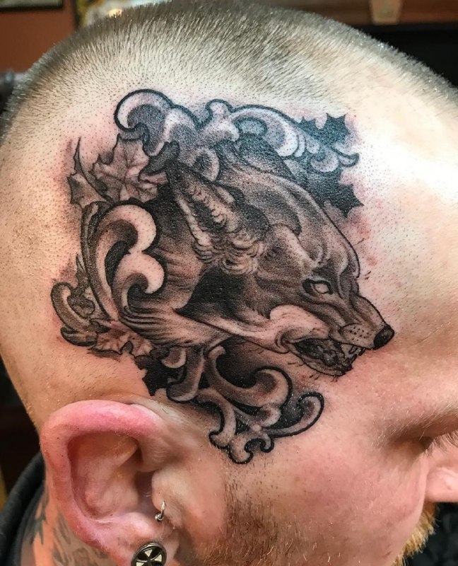 Large wolf tattoo on the head for men