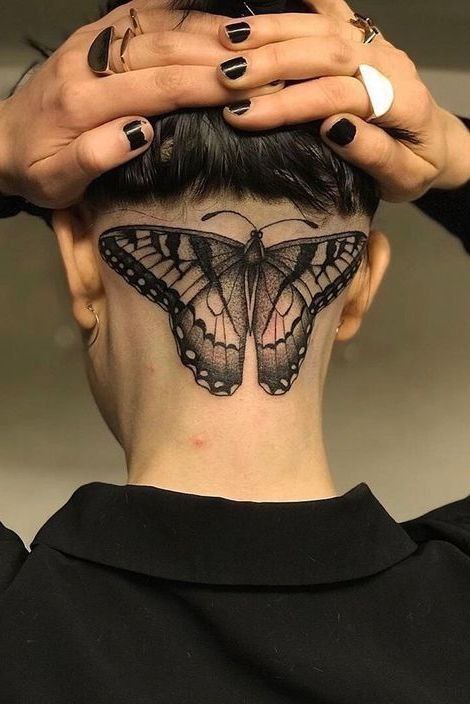 Large butterfly tattoo on the head for women