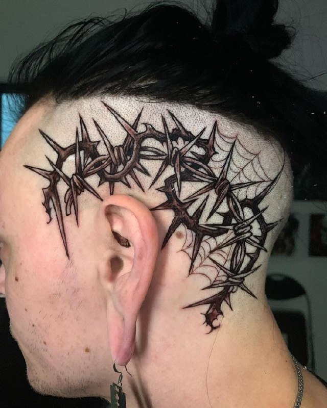 Large barbed wire tattoo on the head for men