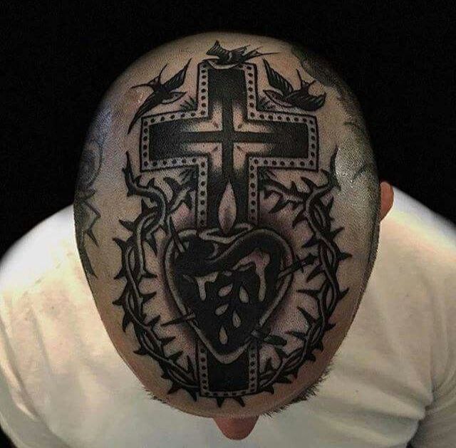 Large cross tattoo on the head for men