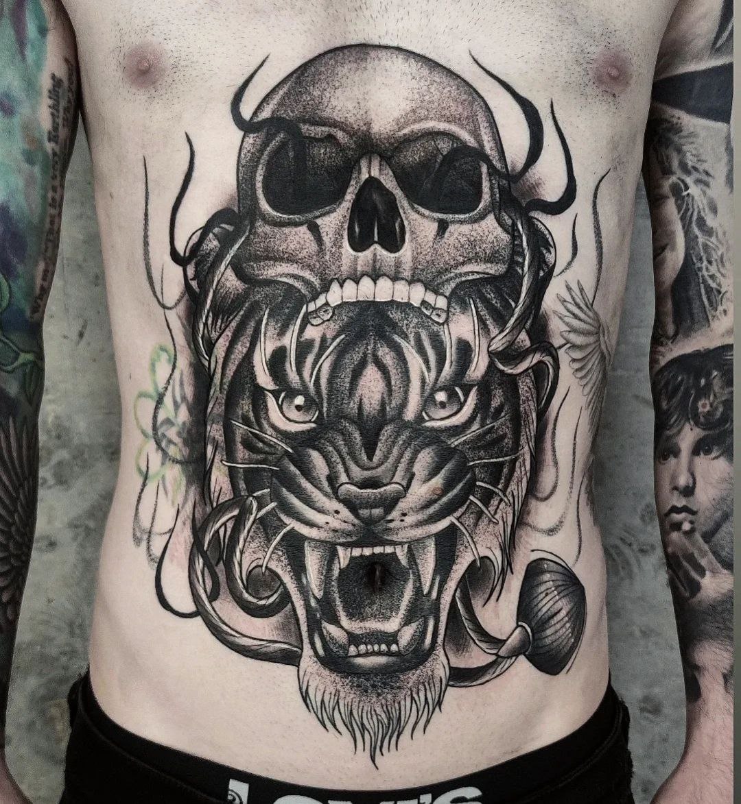 Large tiger and skull tattoo on the giovet for men