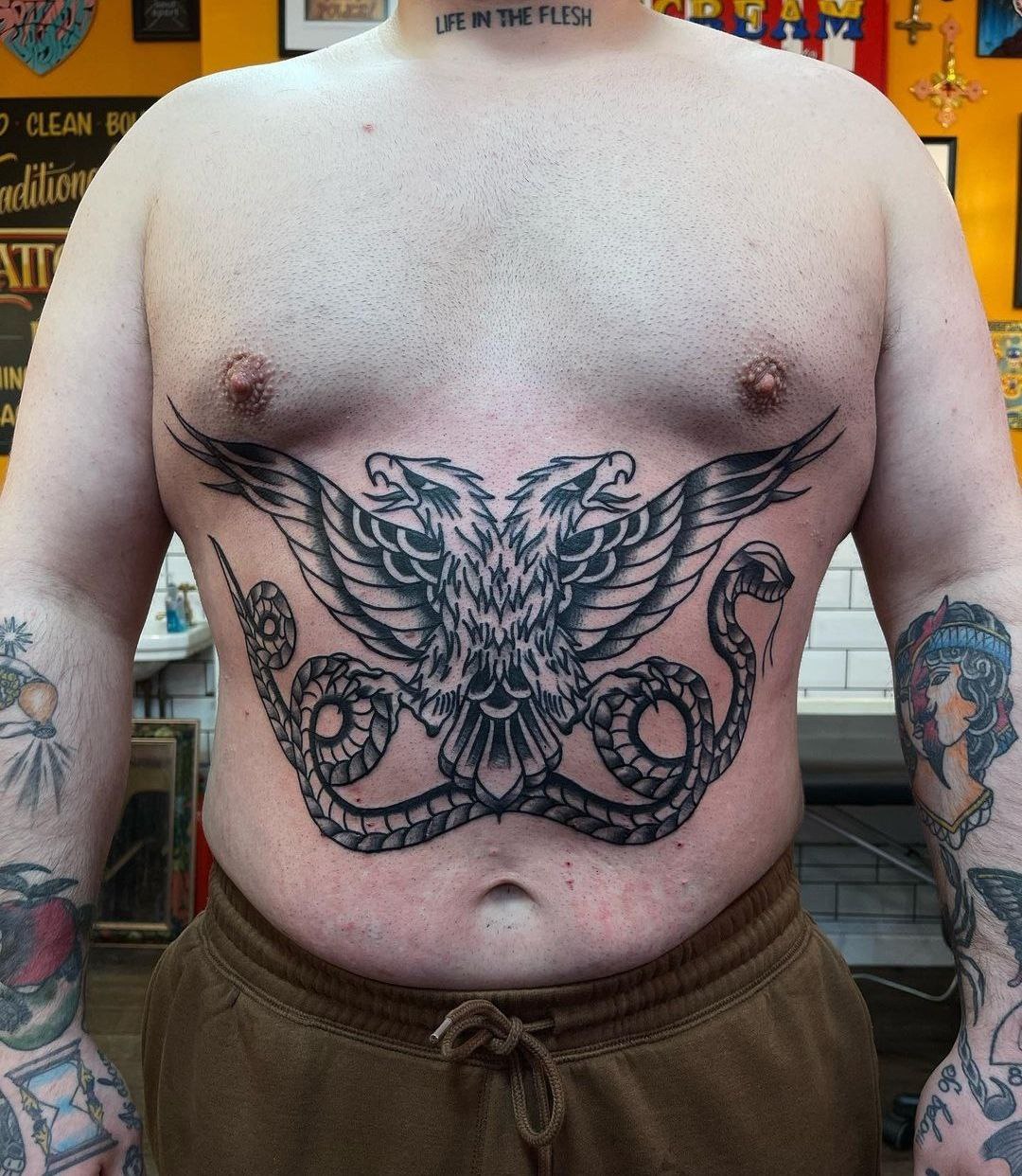 Large tattoo on the abdomen for men