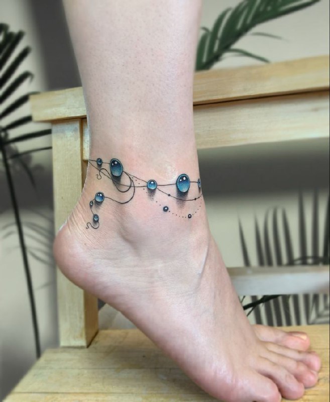 Colorful ankle balloon tattoo for women