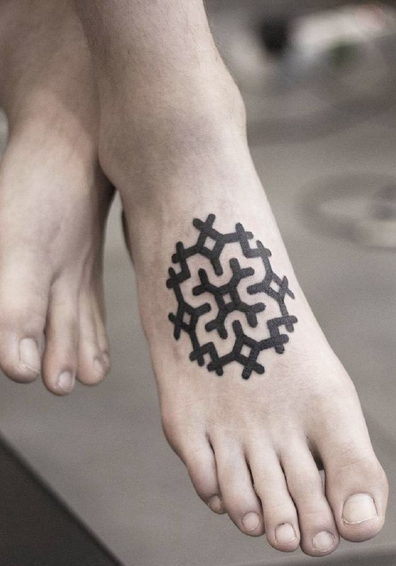 Ankle symbol tattoo for women