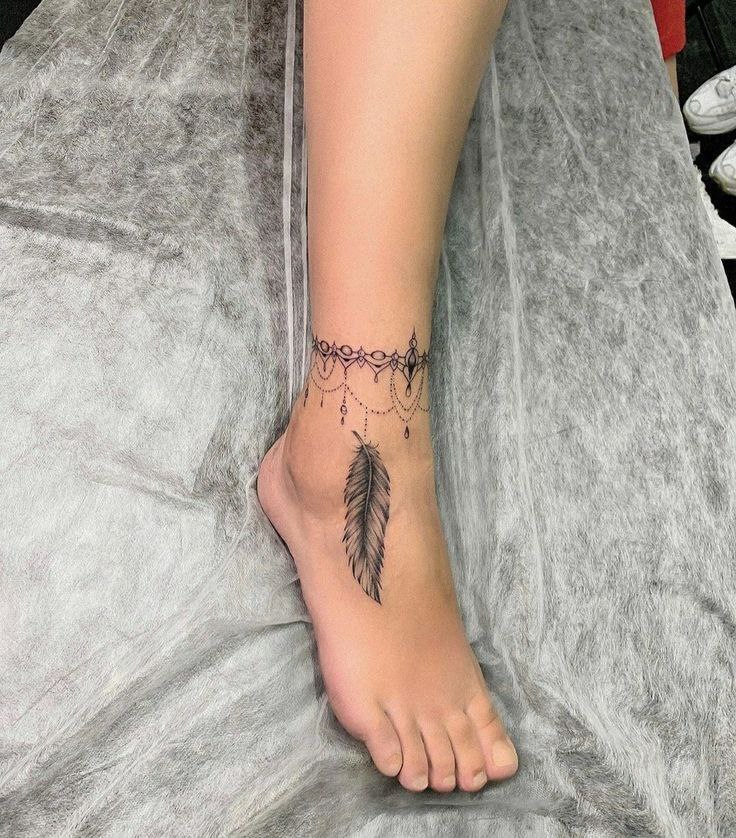 Ankle feather tattoo for women