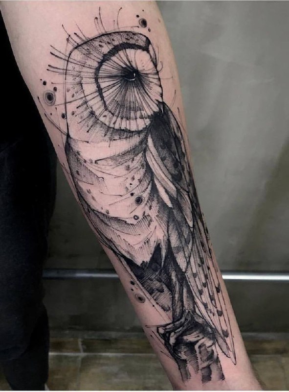 Large owl tattoo on the forearm for men