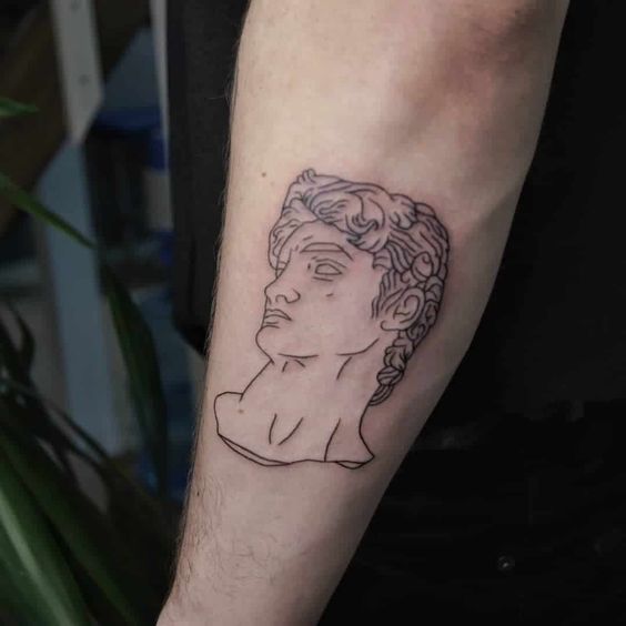 Greek-style tattoo on the forearm for men