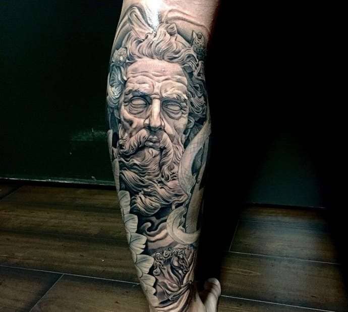 Large greek-style Poseidon tattoo on calves for men