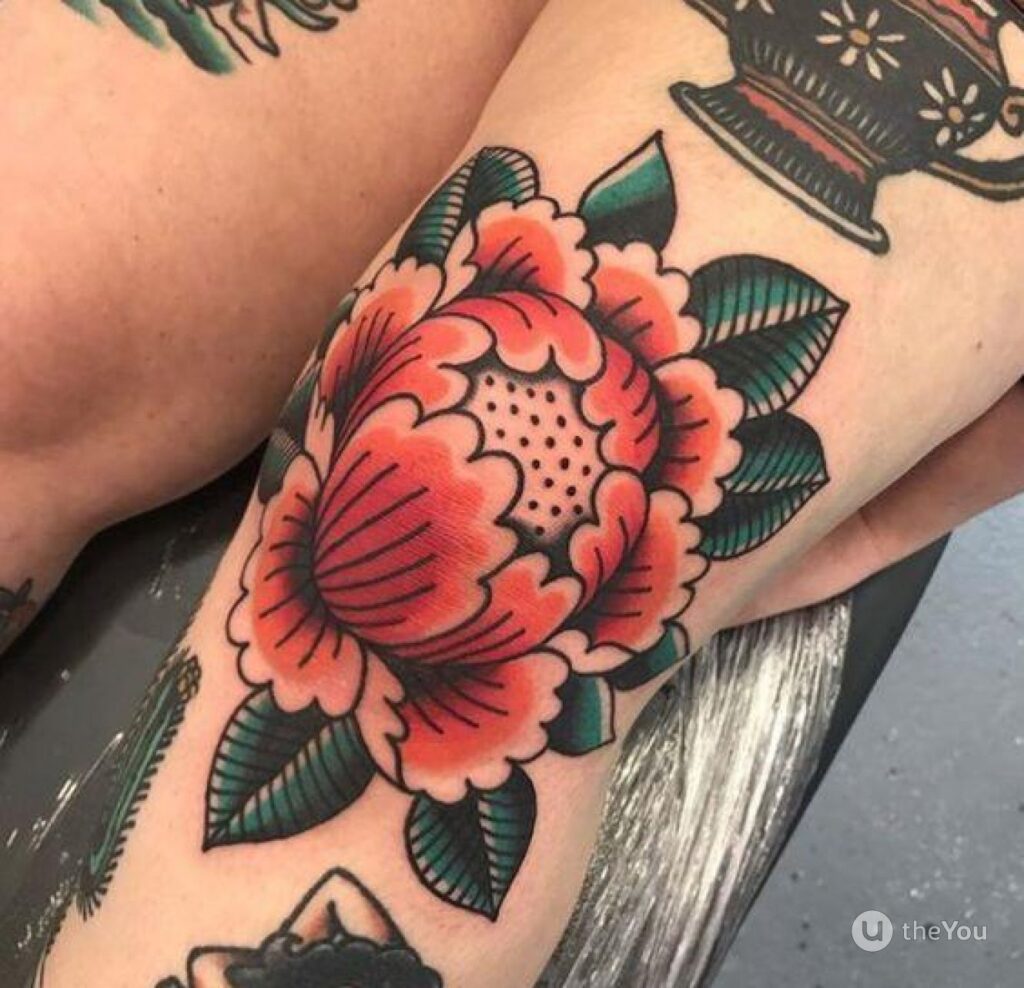 Color tattoo on the knee for men