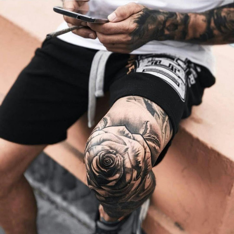 Large rose tattoo on the knee for men