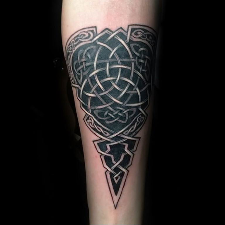 Celtic style tattoo on the forearm for men