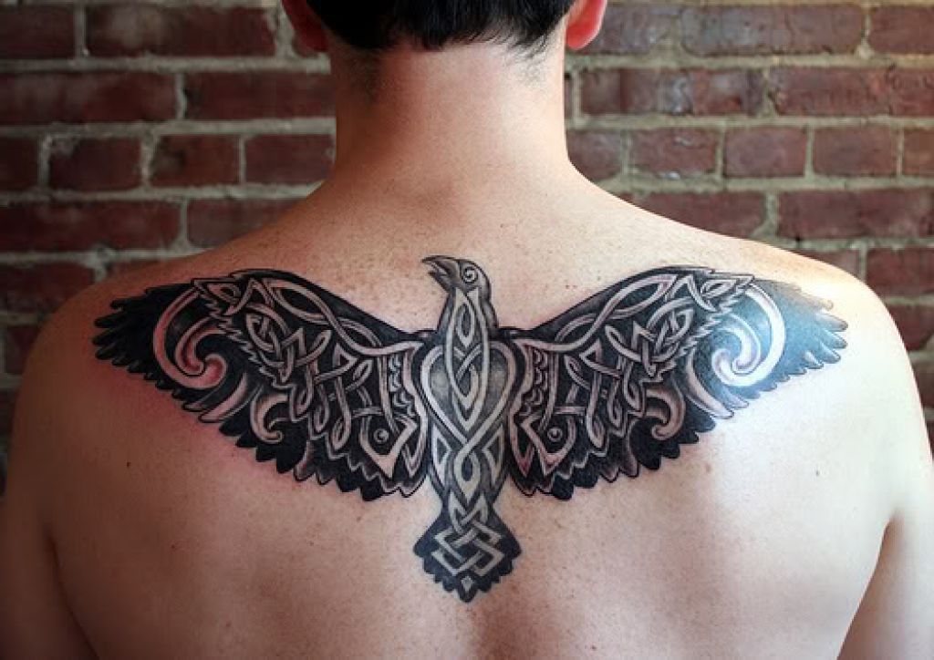 Celtic style tattoo on the back for men