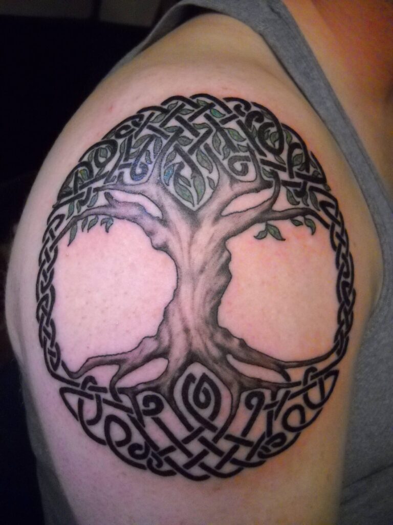 Celtic style tree tattoo on shoulder for men