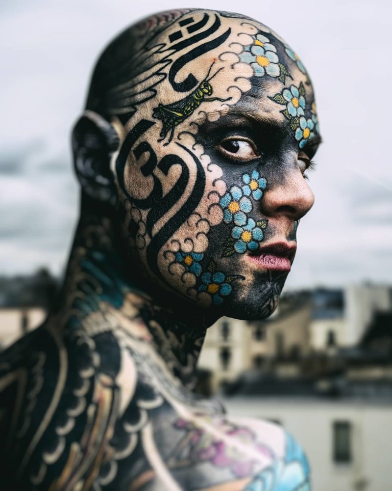 Colored face tattoo for men