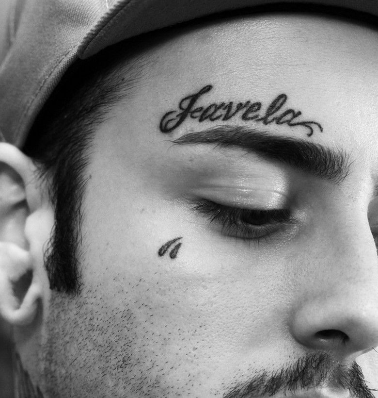 Tattoo with inscription on the face for men