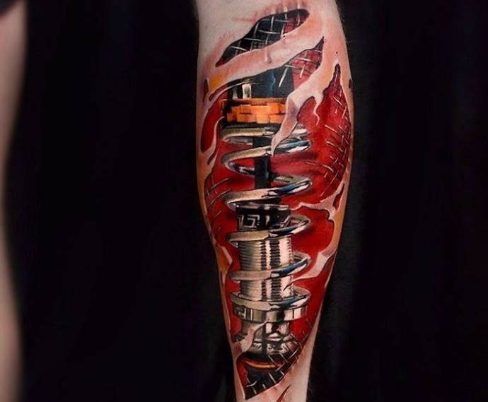 Color biomechanics style tattoo on the forearm for men