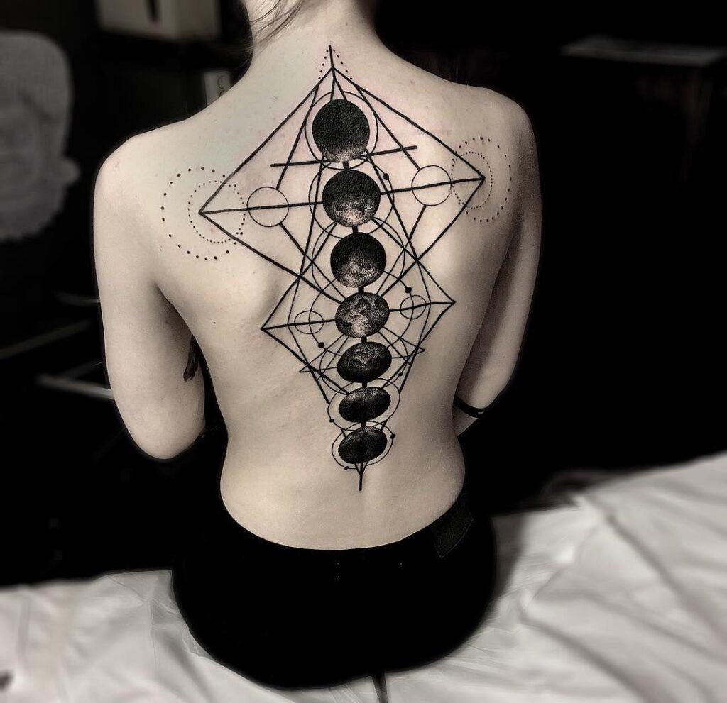 Large tattoo on the spine for women