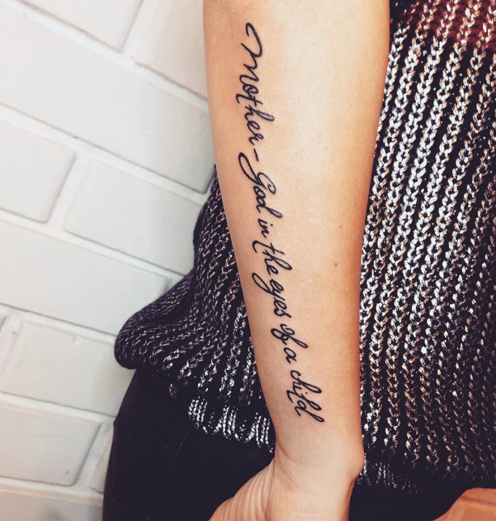 Calligraphy style tattoo on forearm for women